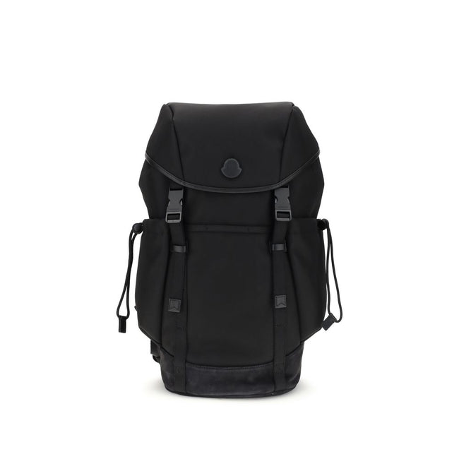 Tech BackpackMoncler’s tech Backpack combines functionality and style in a modern, practical design. Featuring a front flap closure and two snap buckles, it offers security and ease of use. The logo on the front lends a distinctive touch, while adjustable