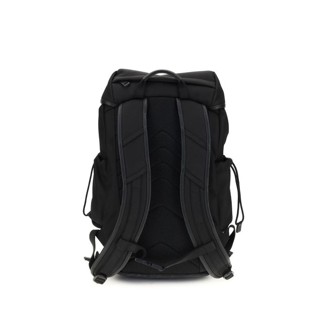 Tech BackpackMoncler’s tech Backpack combines functionality and style in a modern, practical design. Featuring a front flap closure and two snap buckles, it offers security and ease of use. The logo on the front lends a distinctive touch, while adjustable