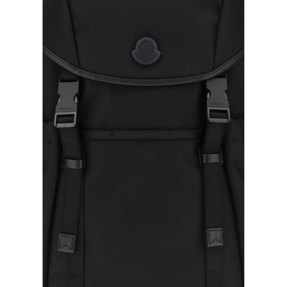 Tech BackpackMoncler’s tech Backpack combines functionality and style in a modern, practical design. Featuring a front flap closure and two snap buckles, it offers security and ease of use. The logo on the front lends a distinctive touch, while adjustable