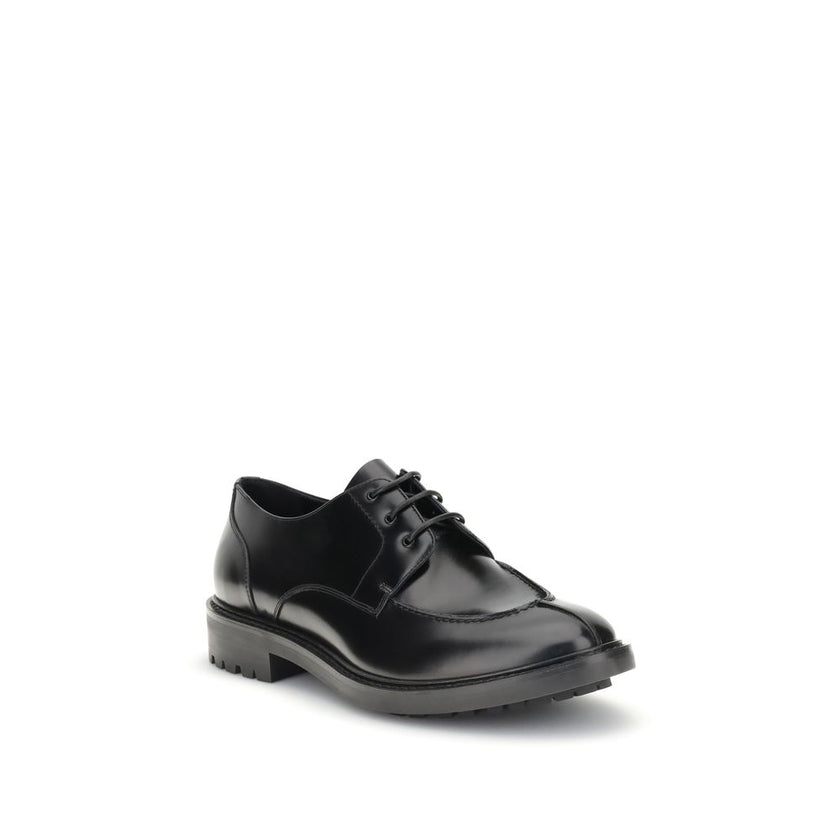 Black Calf Leather Bos Taurus Oxfords And DerbiesSaint Laurent’s leather Lace-Ups reinterpret the classic Derby model with a bold, contemporary twist. Made of smooth leather, they are distinguished by an almond toe and a squared tub construction that lend