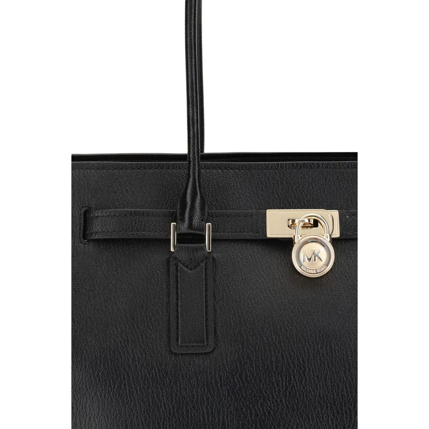 Black Calf Leather Bos Taurus Shoulder BagThe Hamilton Moderne large Tote Bag by Michael Kors is a roomy, structured model designed to combine functionality and elegance. The silhouette with decorative belt and iconic padlock pendant define its sophistica