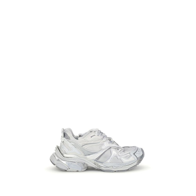 Silver Rubber Athletic SneakersBalenciaga’s Runner 2.0 Sneakers stand out for their worn-in effect, recalling a grunge and lived-in aesthetic typical of the brand. They feature the size printed on the toe and embossed on the back, along with the “Runner”