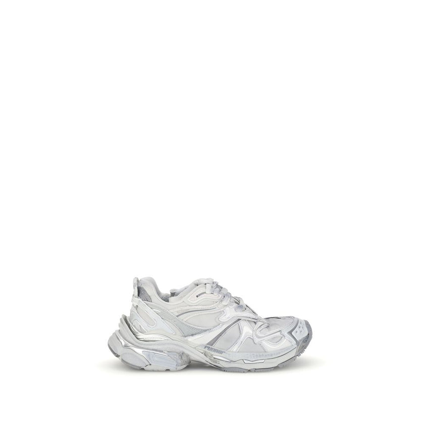 Silver Rubber Athletic SneakersBalenciaga’s Runner 2.0 Sneakers stand out for their worn-in effect, recalling a grunge and lived-in aesthetic typical of the brand. They feature the size printed on the toe and embossed on the back, along with the “Runner”