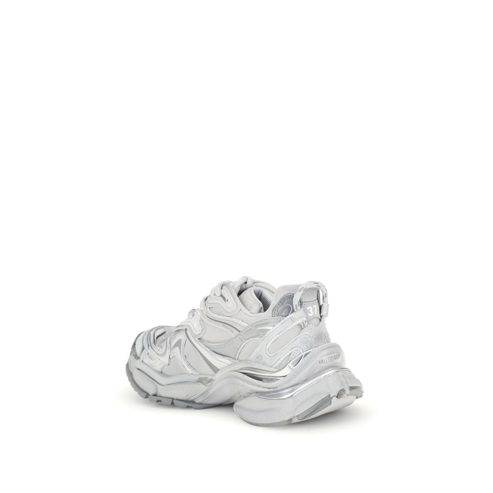 Silver Rubber Athletic SneakersBalenciaga’s Runner 2.0 Sneakers stand out for their worn-in effect, recalling a grunge and lived-in aesthetic typical of the brand. They feature the size printed on the toe and embossed on the back, along with the “Runner”