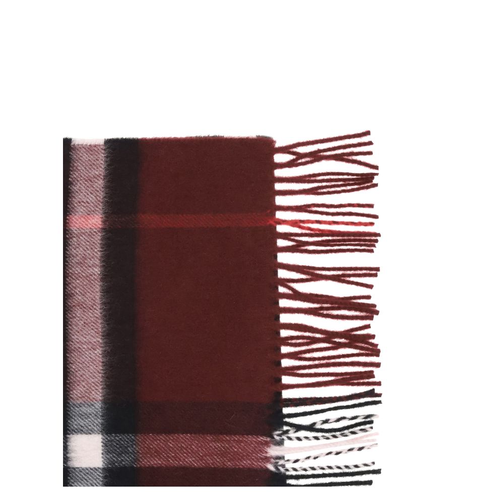 Red Cashmere ScarfThe Check Cashmere Scarf by Burberry is distinguished by its natural luster and ultra-soft finish, achieved through careful craftsmanship in Scotland. Rectangular in shape, it is finished with elegant fringing at the ends that complement