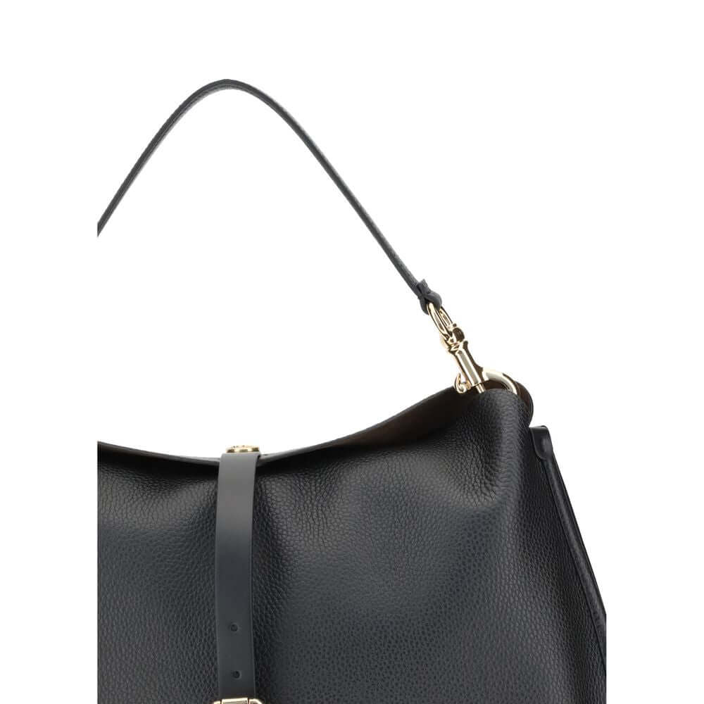 Black Calf Leather Bos Taurus Shoulder BagThe ‘Pony’ XL Shoulder Bag by Etro is made of grained leather with suede lining, combining character and softness. It features a magnetic closure with logo-engraved metal button, enhanced by a leather strap with m