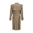 Beige Cotton Trench CoatBurberry’s long cotton gabardine Trench Coat combines tradition and modernity in an iconic garment. Raglan sleeves soften the shoulders, while buttoned welt pockets recall archival designs. Featuring a relaxed fit, it features a do