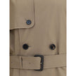 Beige Cotton Trench CoatBurberry’s long cotton gabardine Trench Coat combines tradition and modernity in an iconic garment. Raglan sleeves soften the shoulders, while buttoned welt pockets recall archival designs. Featuring a relaxed fit, it features a do