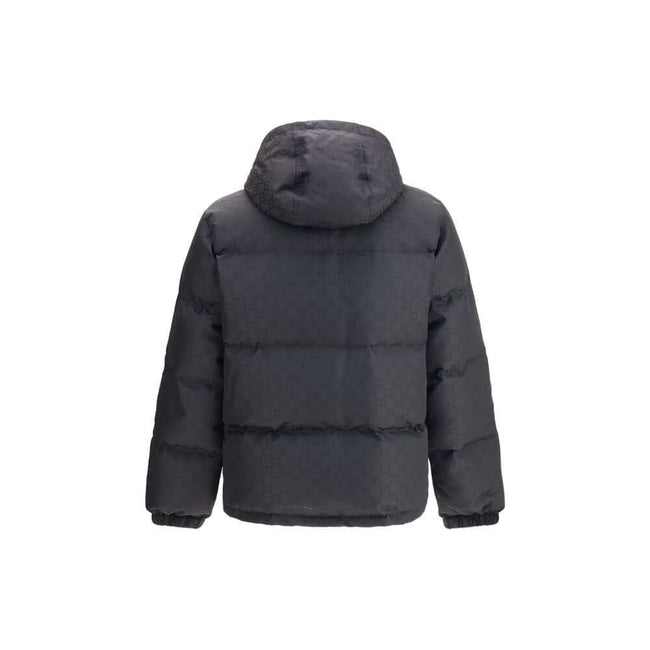 Black Polyamide CoatGucci’s GG patterned padded Down Jacket is an iconic and functional garment. Featuring a hood and double-slider zipper closure, it features the famous “GG” monogram as a distinctive element. Low shoulders and long sleeves with elastic