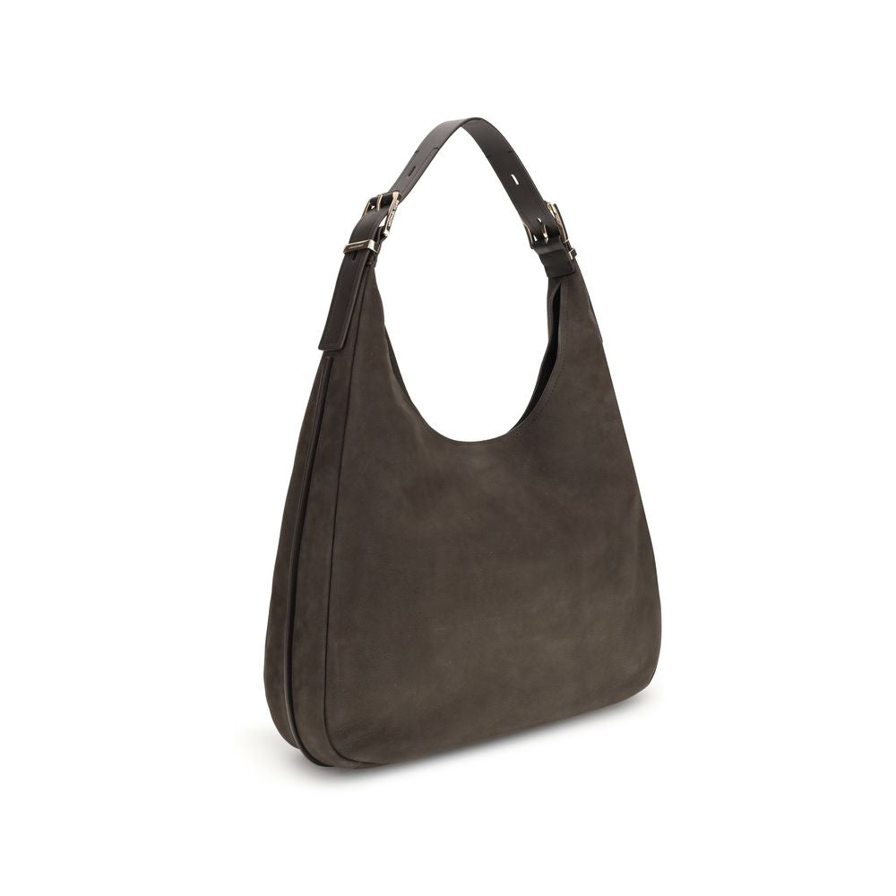 Nolita large Nubuck Shoulder BagThe Nolita large Nubuck Shoulder Bag by Michael Kors combines a casual and sophisticated look, thanks to the soft texture of the nubuck and the textured edges that elegantly define its shape. Featuring an adjustable shoulde
