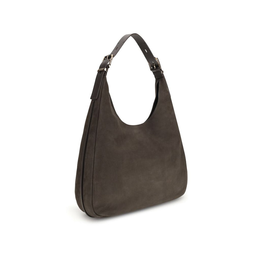Nolita large Nubuck Shoulder BagThe Nolita large Nubuck Shoulder Bag by Michael Kors combines a casual and sophisticated look, thanks to the soft texture of the nubuck and the textured edges that elegantly define its shape. Featuring an adjustable shoulde