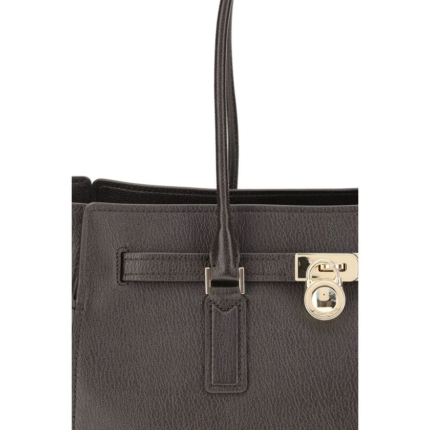 Brown Calf Leather Bos Taurus Shoulder BagThe Hamilton Moderne large Tote Bag by Michael Kors is a roomy, structured model designed to combine functionality and elegance. The silhouette with decorative belt and iconic padlock pendant define its sophistica