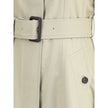 Beige Cotton CoatBurberry’s Ellingham fit-and-flare long gabardine Trench Coat reinterprets an icon of the British wardrobe with a touch of femininity and structure. Featuring a flared silhouette and a single-breasted button closure, it has a figure-flatt