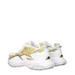 Gold Fabric Low Top SneakersDescription: The product with MPN 10163181A146866WG4V and code F84197 fabric in gold is a sneakers designed by Versace. It has features like front logo, side logo, back logo, print which can vary.Gold Fabric Low Top Sneakers${t