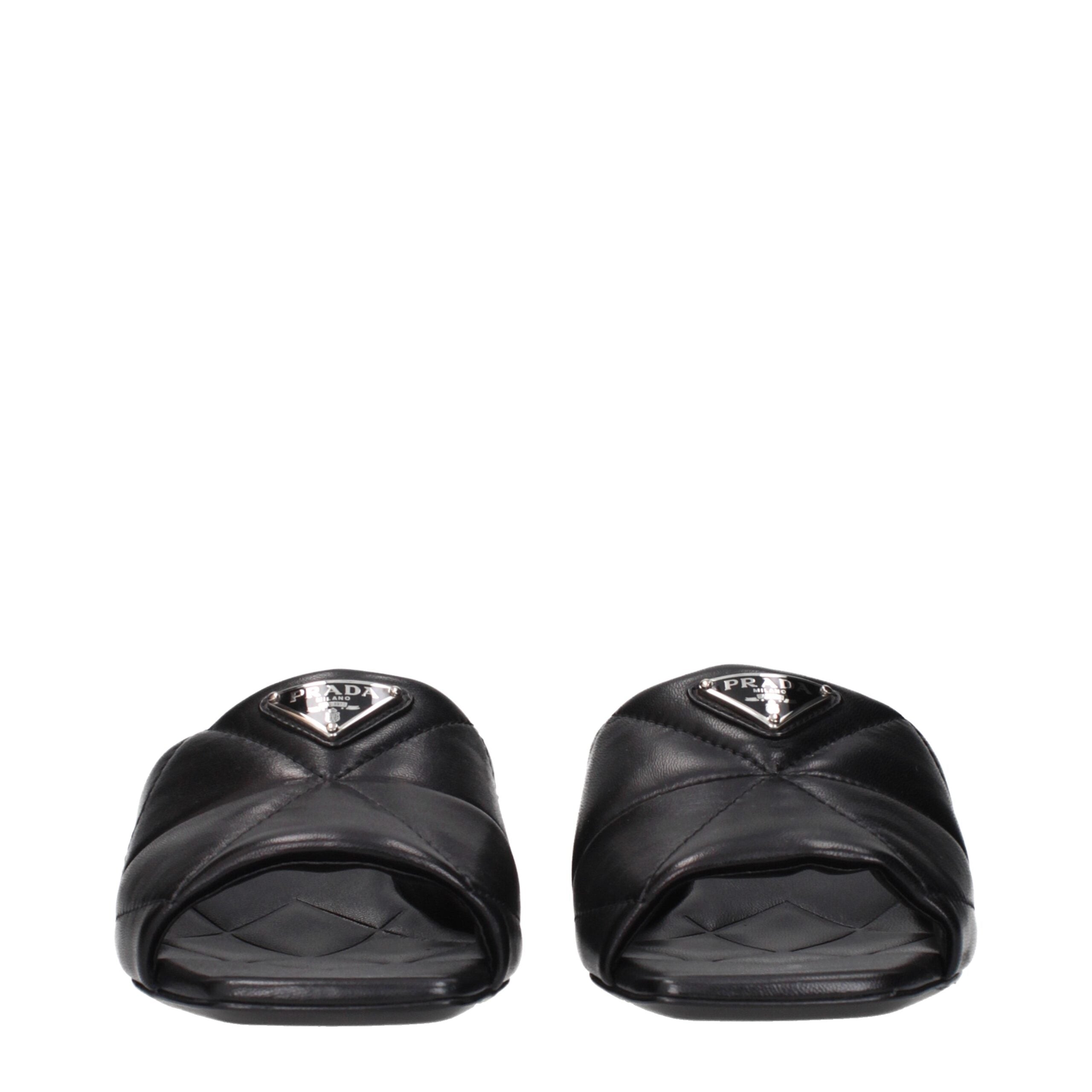 Black Leather Flat SandalsDescription: The product with MPN 1XX656038035F0002 and code F84279 leather in black is a sandals designed by Prada. It has features like front logo.Black Leather Flat Sandals${tagsPradaAulae Black Leather Sandals PradaAulae Blac
