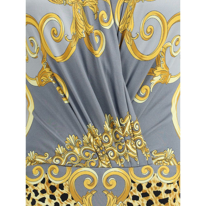 Multicolor Viscose TopVersace’s leopard draped Bodysuit is a bold and sensual garment made of soft jersey with Cheetah Foulard print and Barocco motifs. Featuring long sleeves and a deep draped V-neckline, it has a hook-and-eye closure that ensures a flaw