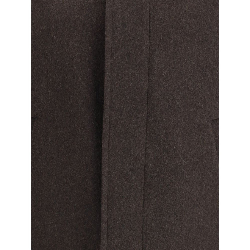 Brown Cashmere CoatBurberry’s cashmere Jacket is an elegant and refined piece, featuring a classic collar and a concealed front button closure that enhances the clean design. The short style features two welt pockets on the front, perfect for a sophistica