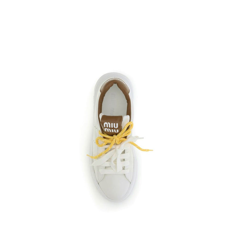 White Rubber Low Top SneakersThe Miu Miu leather Sneakers you describe are a sophisticated and distinctive design. The two-tone double lace-up closure on the front lends a touch of originality, while the round toe ensures comfort and style. The iconic mon