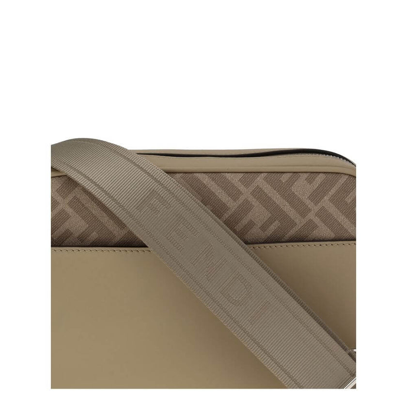 Beige Leather Shoulder BagFendi’s Camera Case Squared FF Shoulder Bag is a compact and refined model made of smooth beige leather combined with iconic FF canvas in the same tone. Embellished with a metal FF appliqué, it features an exterior flat pocket an