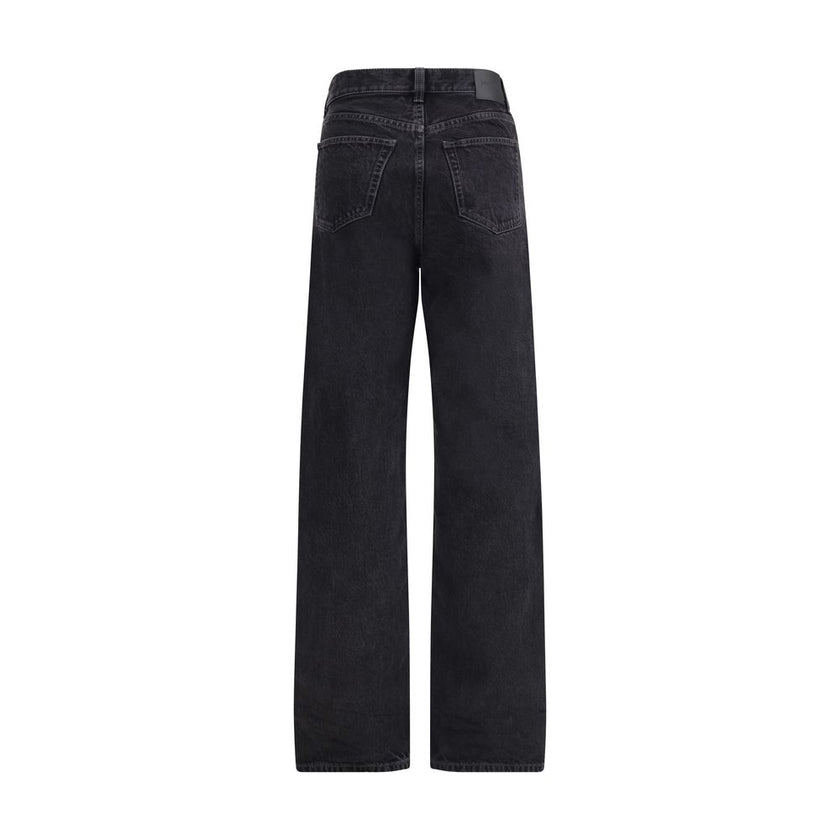 Black Cotton Slim Fit JeansSaint Laurent’s V-waist Jeans stand out for their original tailored cut. Made in the classic five-pocket style, they feature a button and flap closure with buttons. The V waist, enriched with belt loops, gives a modern, slim sil