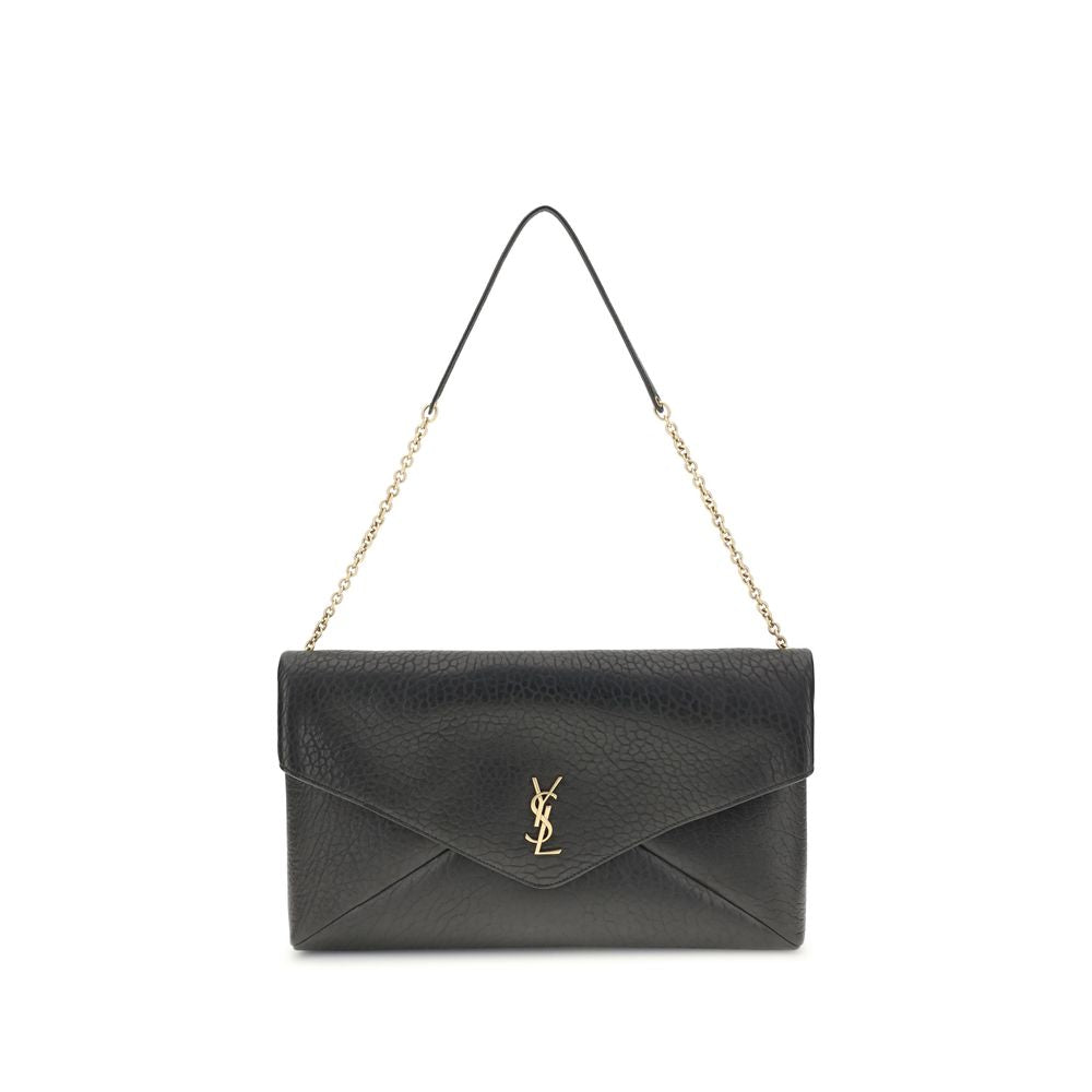 Black Lamb Ovis Aries Aries Shoulder BagThe Cassandre XXL Shoulder Bag with Chain by Saint Laurent is an extra-large clutch made of soft lambskin leather, embellished with the iconic metal Cassandre logo. Equipped with a stowable cable chain strap, it can