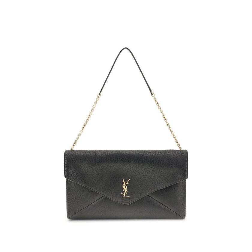 Black Lamb Ovis Aries Aries Shoulder BagThe Cassandre XXL Shoulder Bag with Chain by Saint Laurent is an extra-large clutch made of soft lambskin leather, embellished with the iconic metal Cassandre logo. Equipped with a stowable cable chain strap, it can