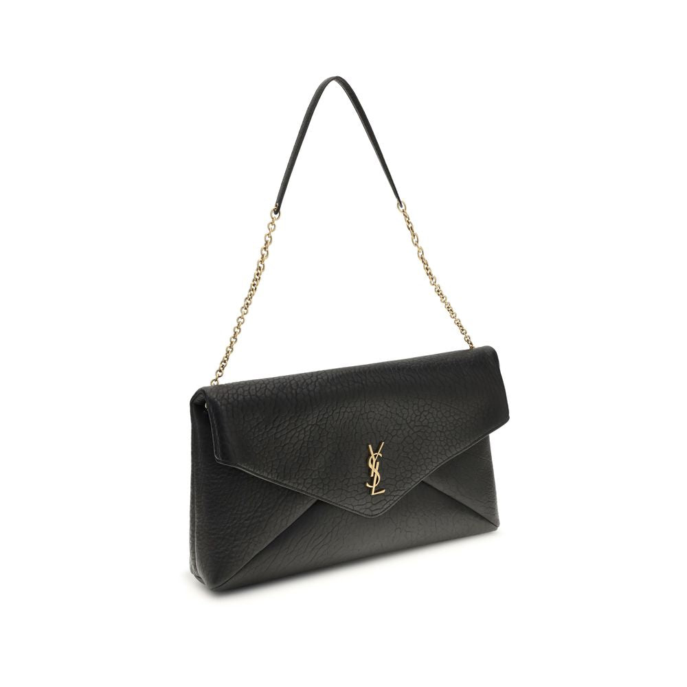 Black Lamb Ovis Aries Aries Shoulder BagThe Cassandre XXL Shoulder Bag with Chain by Saint Laurent is an extra-large clutch made of soft lambskin leather, embellished with the iconic metal Cassandre logo. Equipped with a stowable cable chain strap, it can