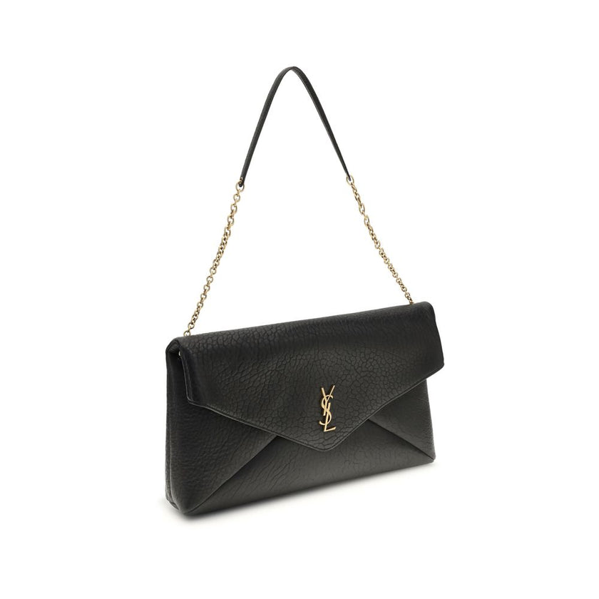Black Lamb Ovis Aries Aries Shoulder BagThe Cassandre XXL Shoulder Bag with Chain by Saint Laurent is an extra-large clutch made of soft lambskin leather, embellished with the iconic metal Cassandre logo. Equipped with a stowable cable chain strap, it can