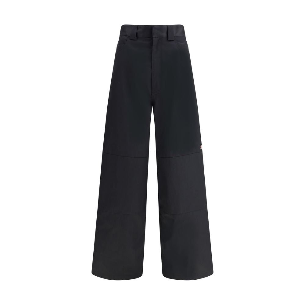 Black Cotton Casual PantsBalenciaga’s Utility Workwear Pants reinterpret workwear style with a contemporary twist. Made of durable cotton twill, they feature a hidden zipper flap, seven belt loops at the waist, two slit pockets at the front and two welt p