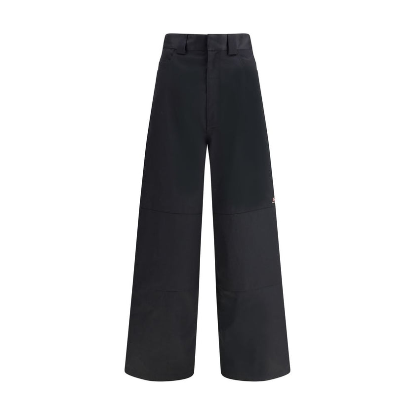 Black Cotton Casual PantsBalenciaga’s Utility Workwear Pants reinterpret workwear style with a contemporary twist. Made of durable cotton twill, they feature a hidden zipper flap, seven belt loops at the waist, two slit pockets at the front and two welt p