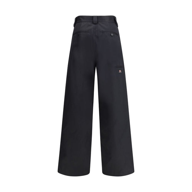 Black Cotton Casual PantsBalenciaga’s Utility Workwear Pants reinterpret workwear style with a contemporary twist. Made of durable cotton twill, they feature a hidden zipper flap, seven belt loops at the waist, two slit pockets at the front and two welt p