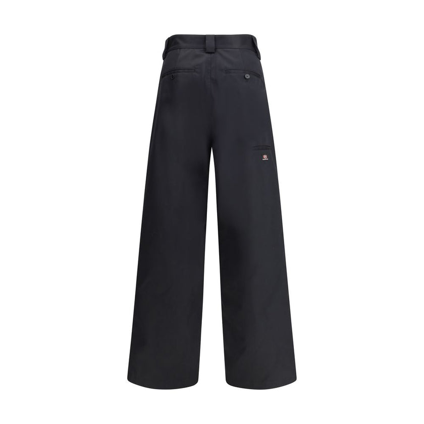 Black Cotton Casual PantsBalenciaga’s Utility Workwear Pants reinterpret workwear style with a contemporary twist. Made of durable cotton twill, they feature a hidden zipper flap, seven belt loops at the waist, two slit pockets at the front and two welt p