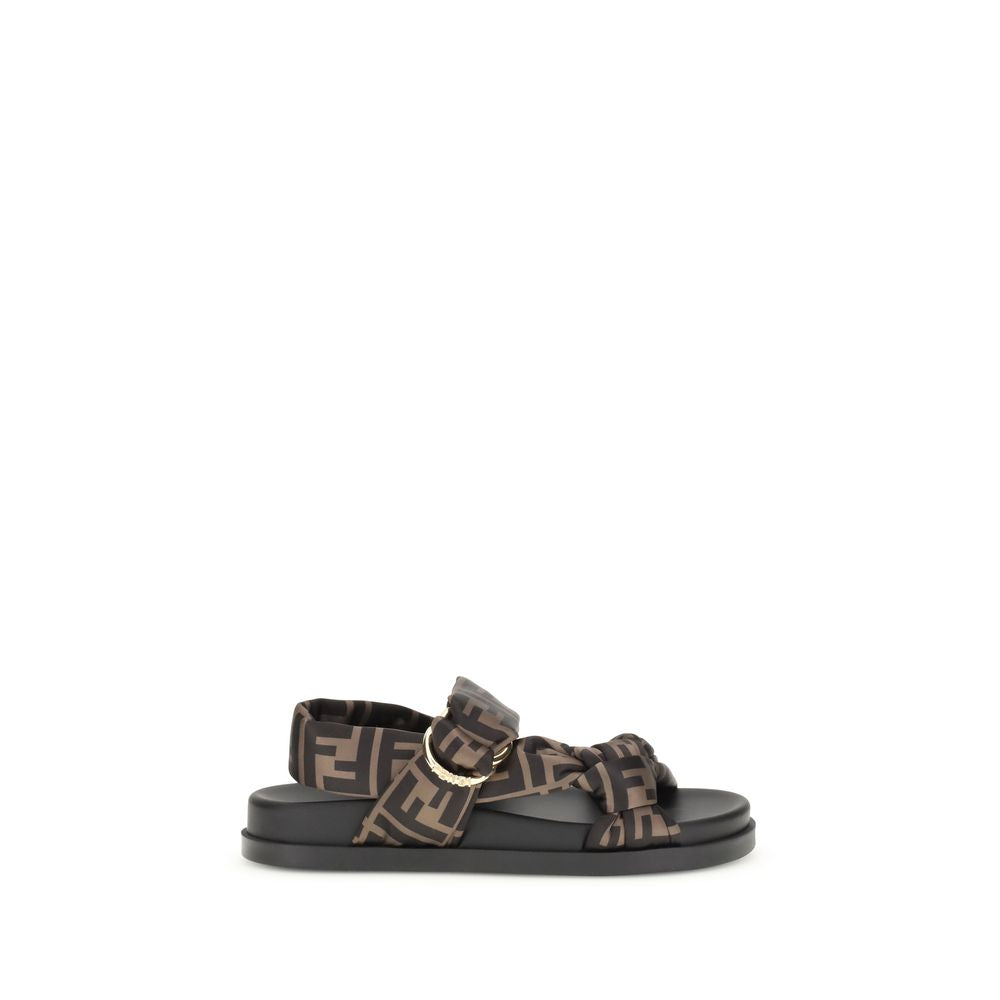 FF satin SandalsFendi’s FF satin Sandals combine bold style and iconic details. The design features padded straps and a decorative D-ring buckle with three-dimensional Fendi lettering, lending character and recognition to the model. Made of satin with the