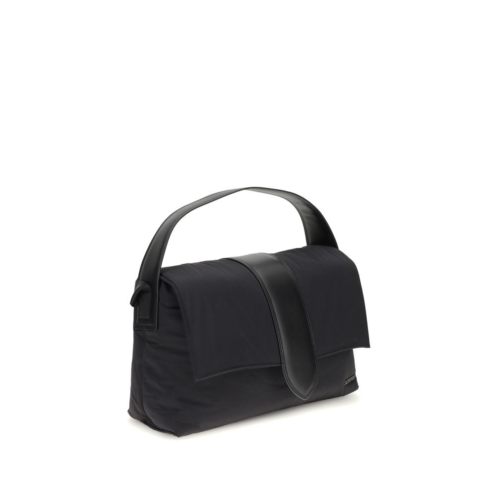 Black Nylon Shoulder BagThe Bambino Shoulder Bag by Jacquemus reinterprets the messenger style with a practical, contemporary design. Made of padded nylon, it features a leather handle and magnetic flap with tab, combined with a zipper closure for added s