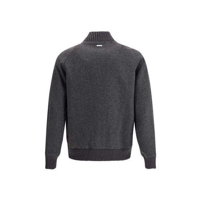 Gray Polyester BomberWoolrich’s wool bomber Jacket is a perfect balance of classic style and modern functionality. Featuring a ribbed collar and a front snap closure, it has cuffs and hem that are also ribbed for a snug fit. Two patch pockets on the front