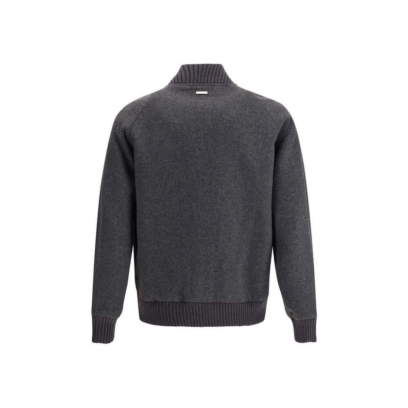 Gray Polyester BomberWoolrich’s wool bomber Jacket is a perfect balance of classic style and modern functionality. Featuring a ribbed collar and a front snap closure, it has cuffs and hem that are also ribbed for a snug fit. Two patch pockets on the front