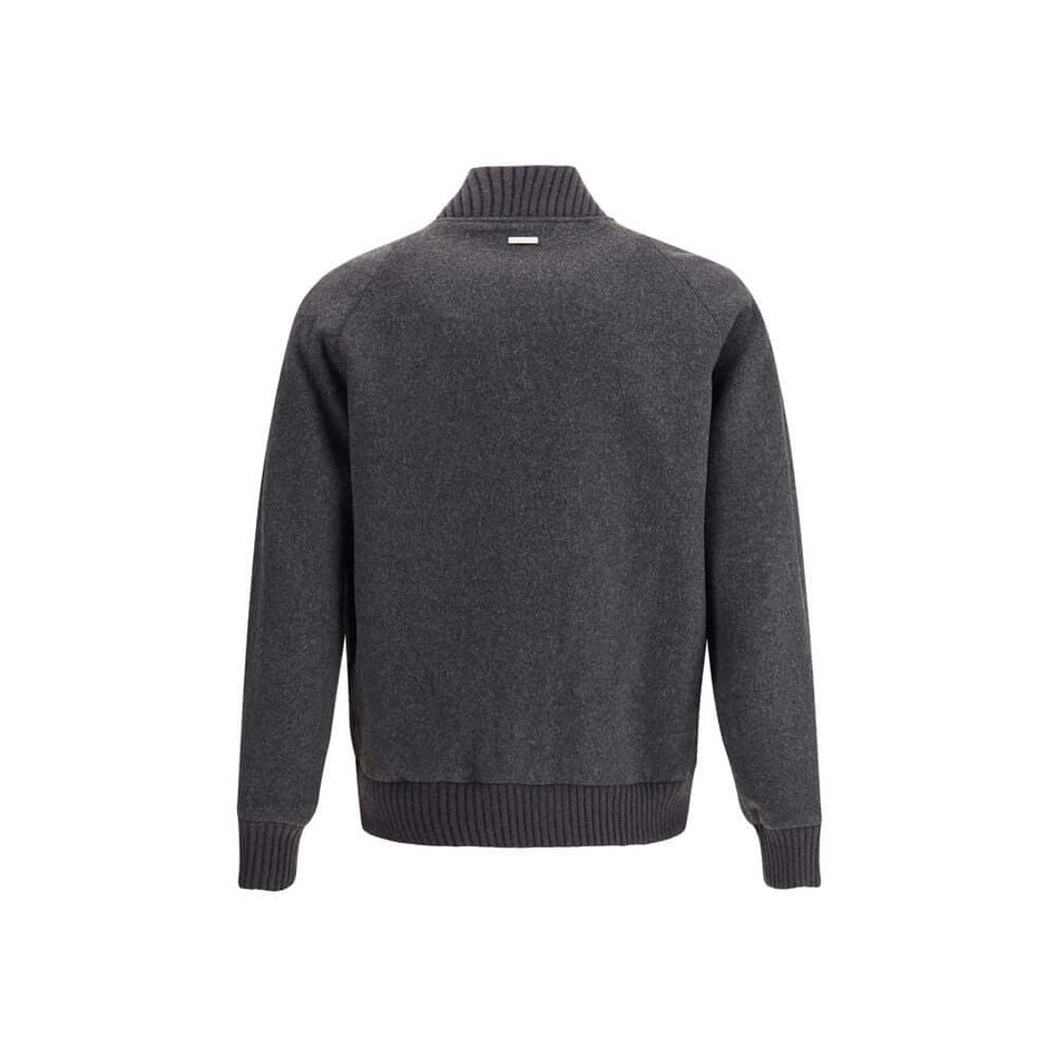 Gray Polyester BomberWoolrich’s wool bomber Jacket is a perfect balance of classic style and modern functionality. Featuring a ribbed collar and a front snap closure, it has cuffs and hem that are also ribbed for a snug fit. Two patch pockets on the front