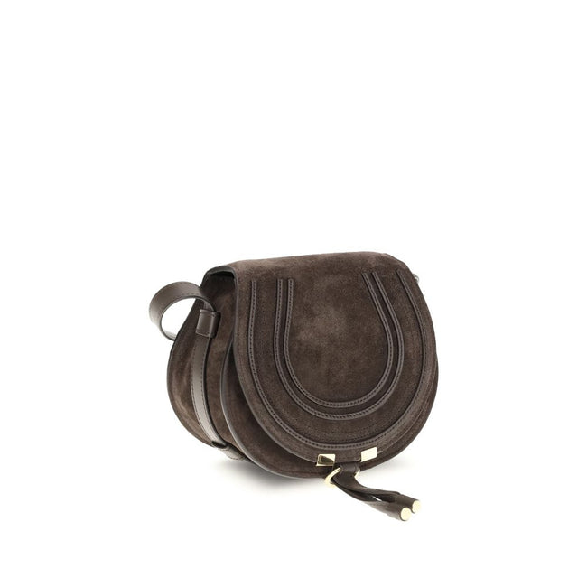 Brown Calf Leather Bos Taurus Shoulder BagChloé’s Marcie small Shoulder Bag stands out for its curved silhouette and defined top profile. The flap, embellished with leather tassels, is embellished with the iconic saddle stitching that characterizes the Ma