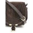 Brown Calf Leather Bos Taurus Shoulder BagChloé’s Marcie small Shoulder Bag stands out for its curved silhouette and defined top profile. The flap, embellished with leather tassels, is embellished with the iconic saddle stitching that characterizes the Ma