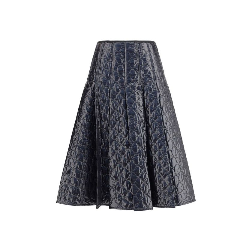 Black Polyamide Midi SkirtMoncler’s padded midi Skirt combines style and functionality in a unique design. Made of iconic laqué nylon with matching lining, it features lightweight padding for thermal comfort. Pleating lends movement and femininity, while