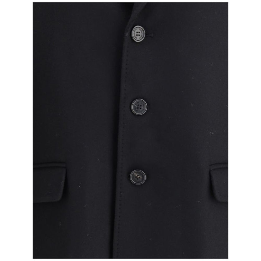 Black Wool CoatDsQuared2’s wool midi Coat is an elegant, structured garment made of felted wool for a warm, compact texture. The single-breasted design is complemented by a front button closure, side pockets and long sleeves. The interior is finished with