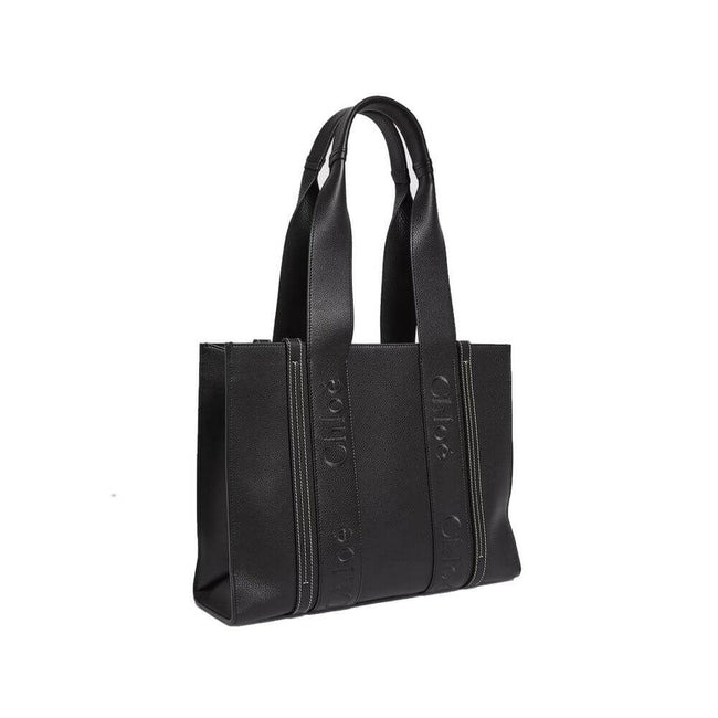 Black Leather Tote BagDescription: – Composition: 100% Leather – Double shoulder strap – On tone logo detail – Interior slip pocket – 45×33 cm – Made in Italy – Gender: WOMEN –Black Leather Tote Bag${tagsChloéAulae Black Leather Tote Bag ChloéAulae Black