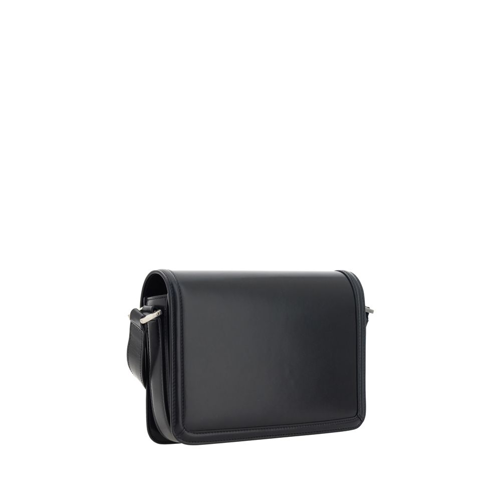Black Calf Leather Bos Taurus Shoulder BagThe Saint Laurent leather Solferino Shoulder Bag is a perfect balance of timeless elegance and modern functionality. Made of high-quality smooth leather, it is distinguished by the iconic YSL logo applied in contr