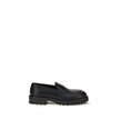 Black Rubber Slip-On LoafersFerragamo’s Penny Loafers reinterpret a classic with a contemporary twist. Featuring a slightly rounded toe and a brushed calfskin upper, they offer the perfect balance of elegance and comfort. Iconic details, such as the conto