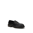 Black Rubber Slip-On LoafersFerragamo’s Penny Loafers reinterpret a classic with a contemporary twist. Featuring a slightly rounded toe and a brushed calfskin upper, they offer the perfect balance of elegance and comfort. Iconic details, such as the conto