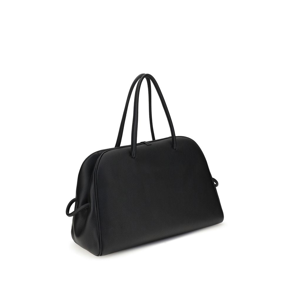 Black Calf Leather Bos Taurus HandbagThe Le Grand Tourisme Travel Bag by Jacquemus reinterprets the classic bowling bag in a modern and sophisticated key. Made of grained leather, it features a structured and functional design with a two-way zipper closur
