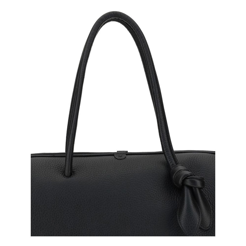 Black Calf Leather Bos Taurus HandbagThe Le Grand Tourisme Travel Bag by Jacquemus reinterprets the classic bowling bag in a modern and sophisticated key. Made of grained leather, it features a structured and functional design with a two-way zipper closur