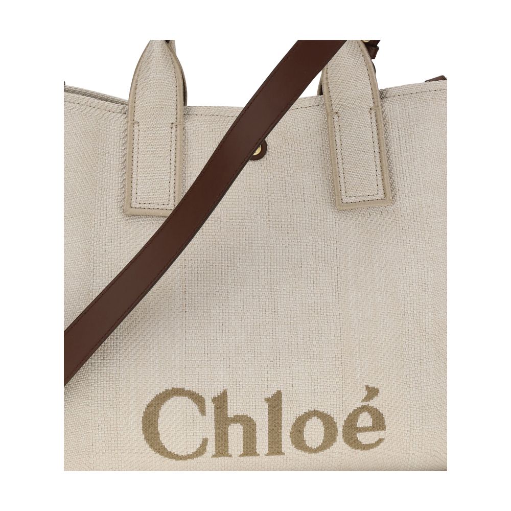 Beige Cotton Shoulder BagChloé’s Carry medium Tote Bag is a true symbol of elegance and practicality. With its two tubular handles and button closure, it represents a perfect balance between style and functionality. The removable and adjustable shoulder s