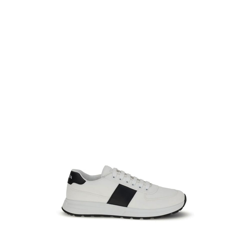 White Calf Leather Bos Taurus Low Top SneakersPrada’s leather Sneakers feature a two-tone design that combines elegance and contemporary style. Featuring a lace-up closure and reinforced toe for added durability, they are complemented by the logo on the b