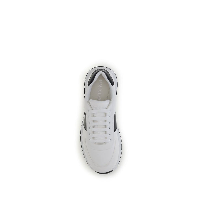White Calf Leather Bos Taurus Low Top SneakersPrada’s leather Sneakers feature a two-tone design that combines elegance and contemporary style. Featuring a lace-up closure and reinforced toe for added durability, they are complemented by the logo on the b